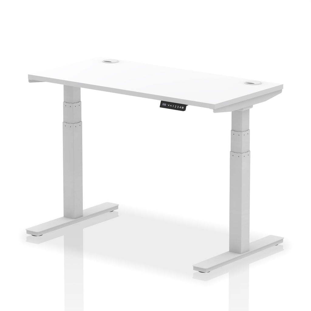 Adjustable height desk with white top and metal legs on a white background