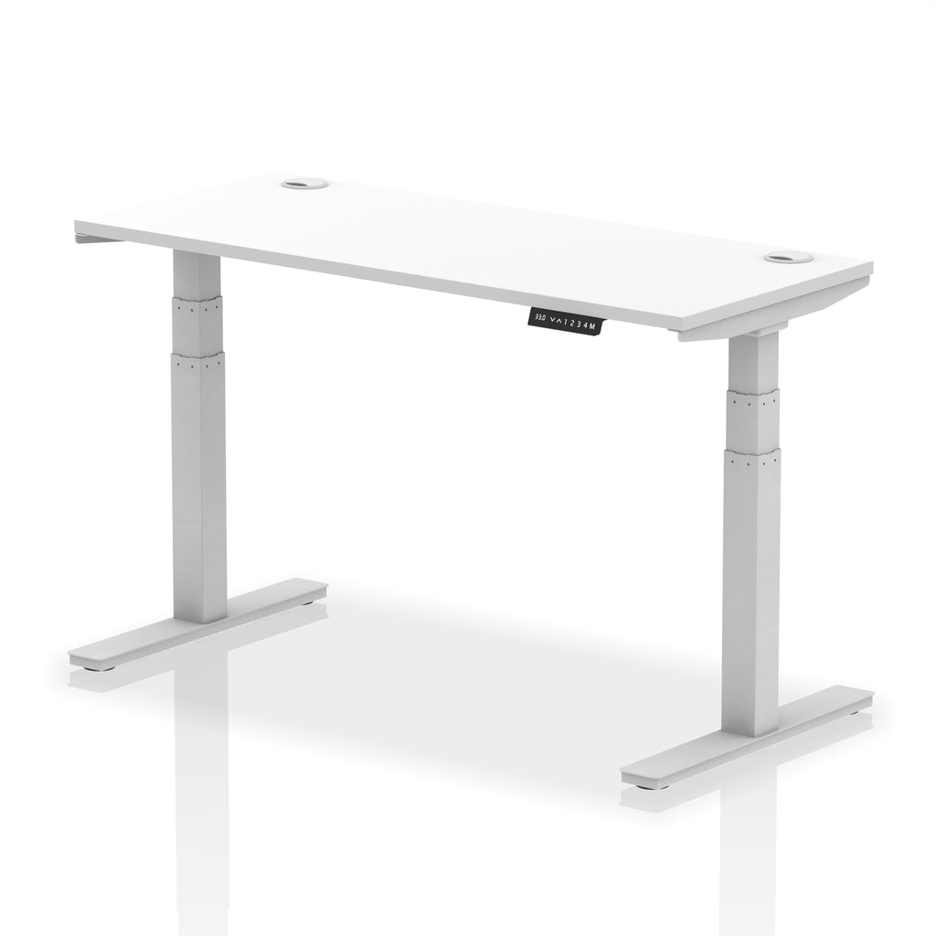 Adjustable height desk with white top and metal legs on a white background