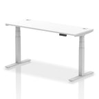 Adjustable height desk with white top and metal legs on a white background