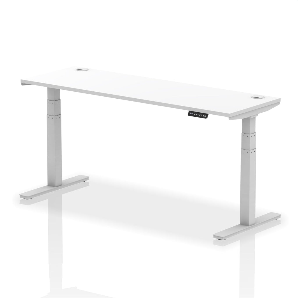 Adjustable height desk with white top and metal legs on a white background