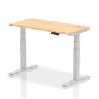 Adjustable height desk with wood-effect top and metal legs on a white background