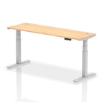 Adjustable height desk with wood-effect top and metal legs on a white background