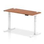 Adjustable height desk with wood-effect top and metal legs on a white background