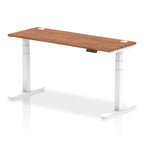 Adjustable height desk with wood-effect top and metal legs on a white background
