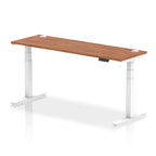 Adjustable height desk with wood-effect top and metal legs on a white background