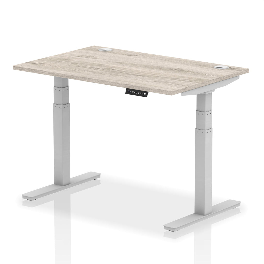 Adjustable height desk with wood-effect top and metal legs on a white background