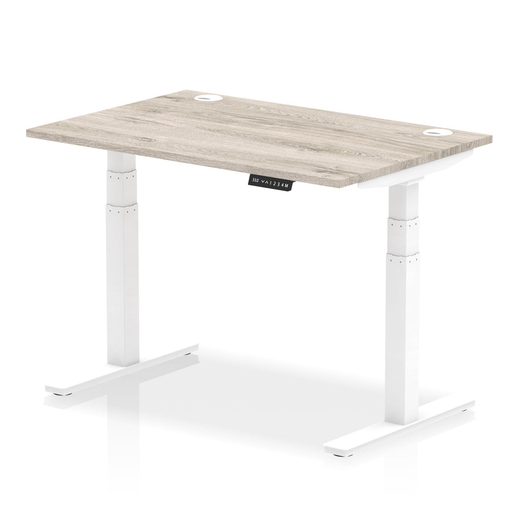 Adjustable height desk with wood-effect top and metal legs on a white background