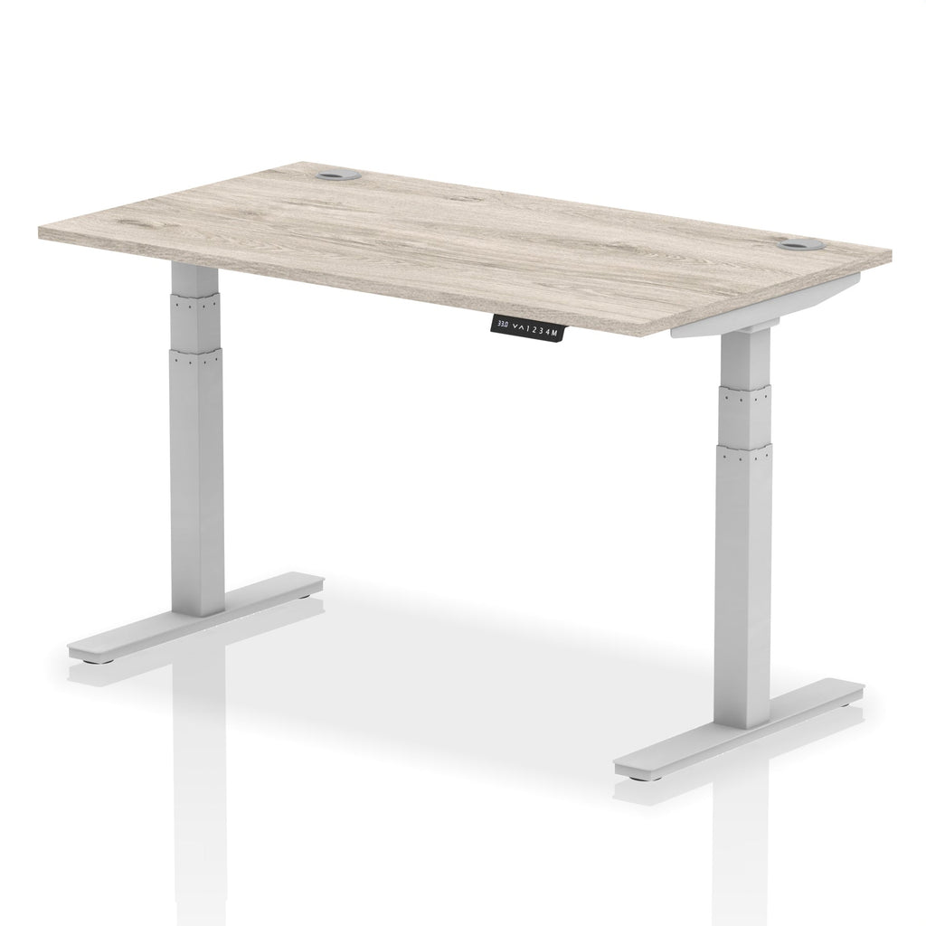 Adjustable height desk with wood-effect top and metal legs on a white background