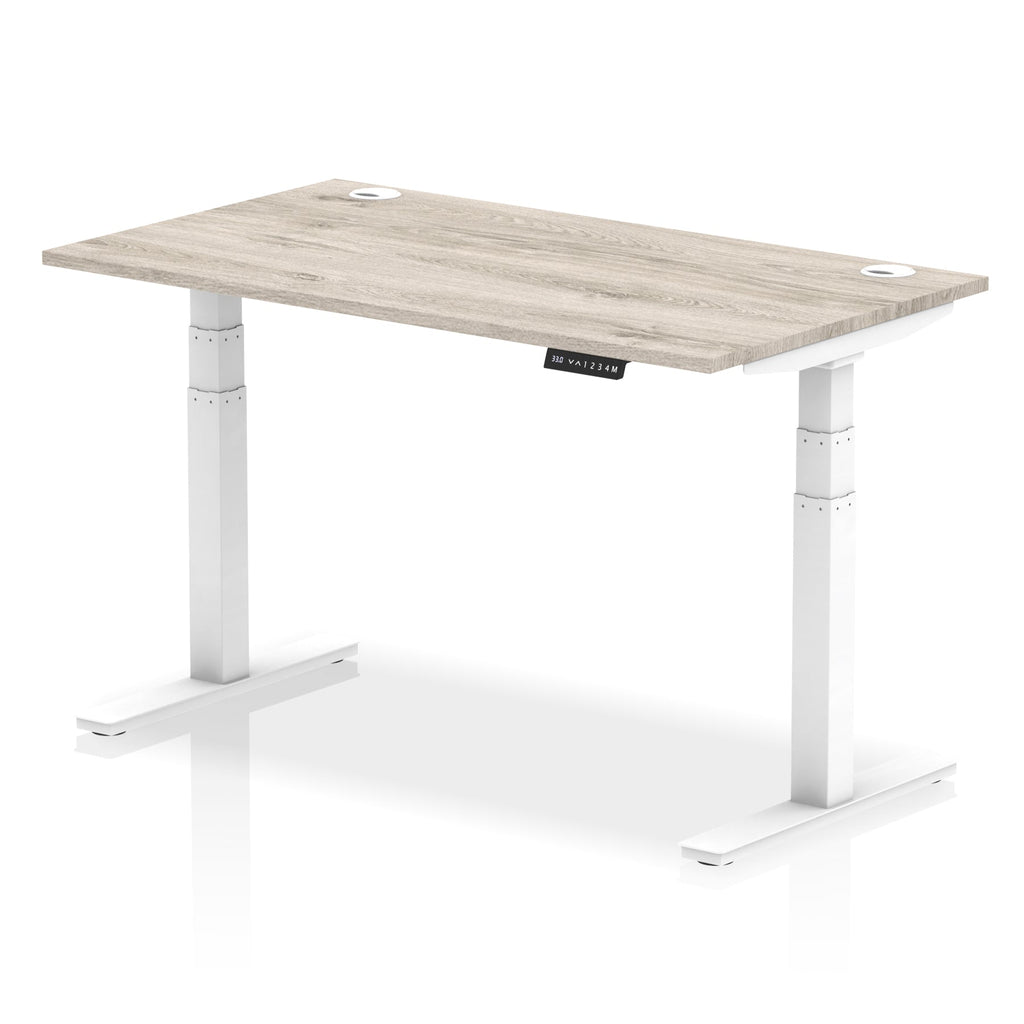 Adjustable height desk with wood-effect top and metal legs on a white background