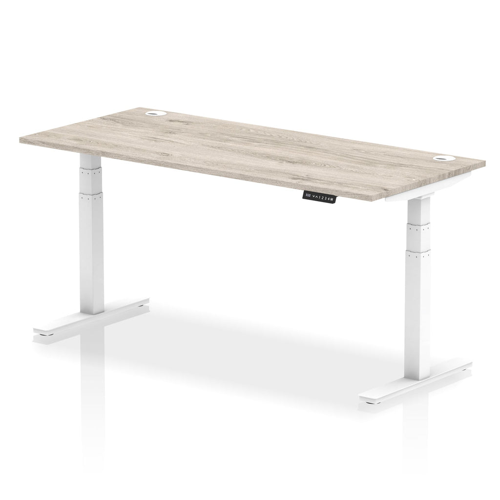Adjustable height desk with wood-effect top and metal legs on a white background