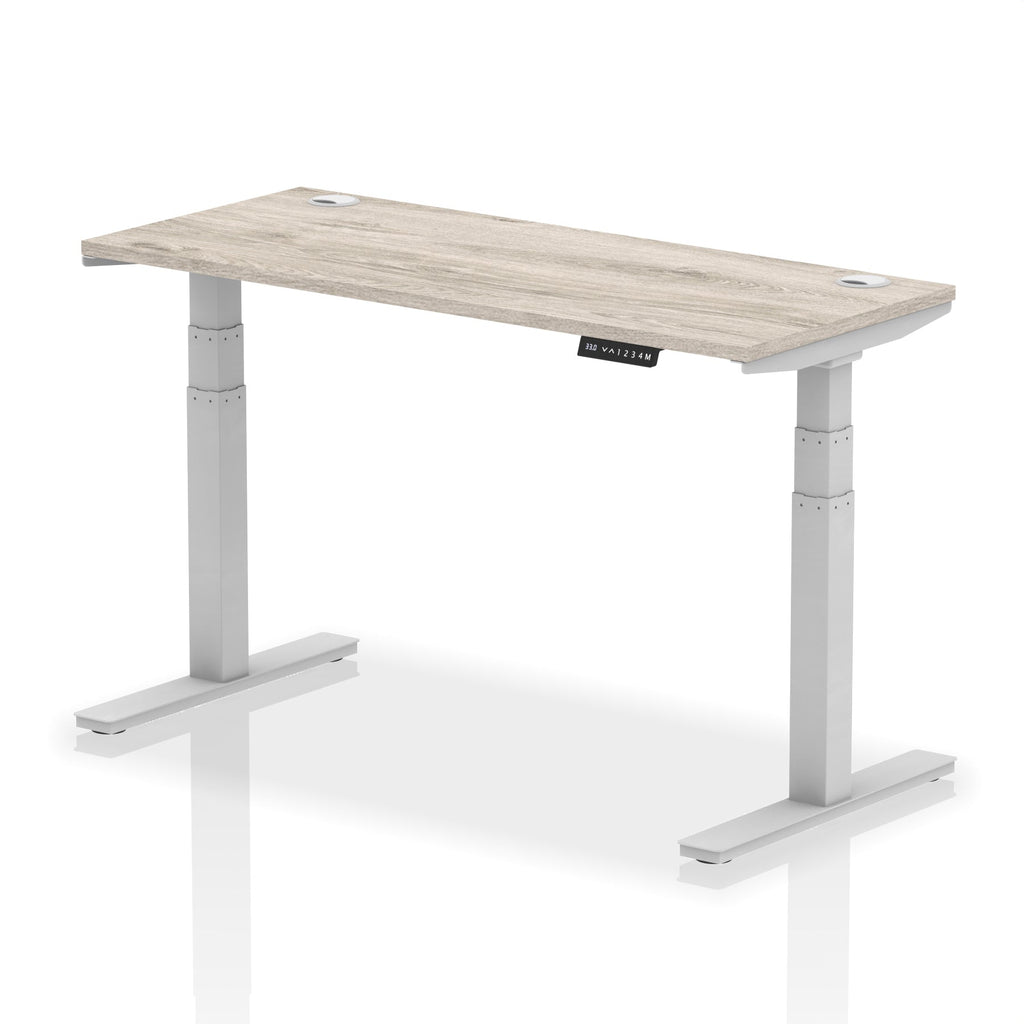 Adjustable height desk with wood-effect top and metal legs on a white background