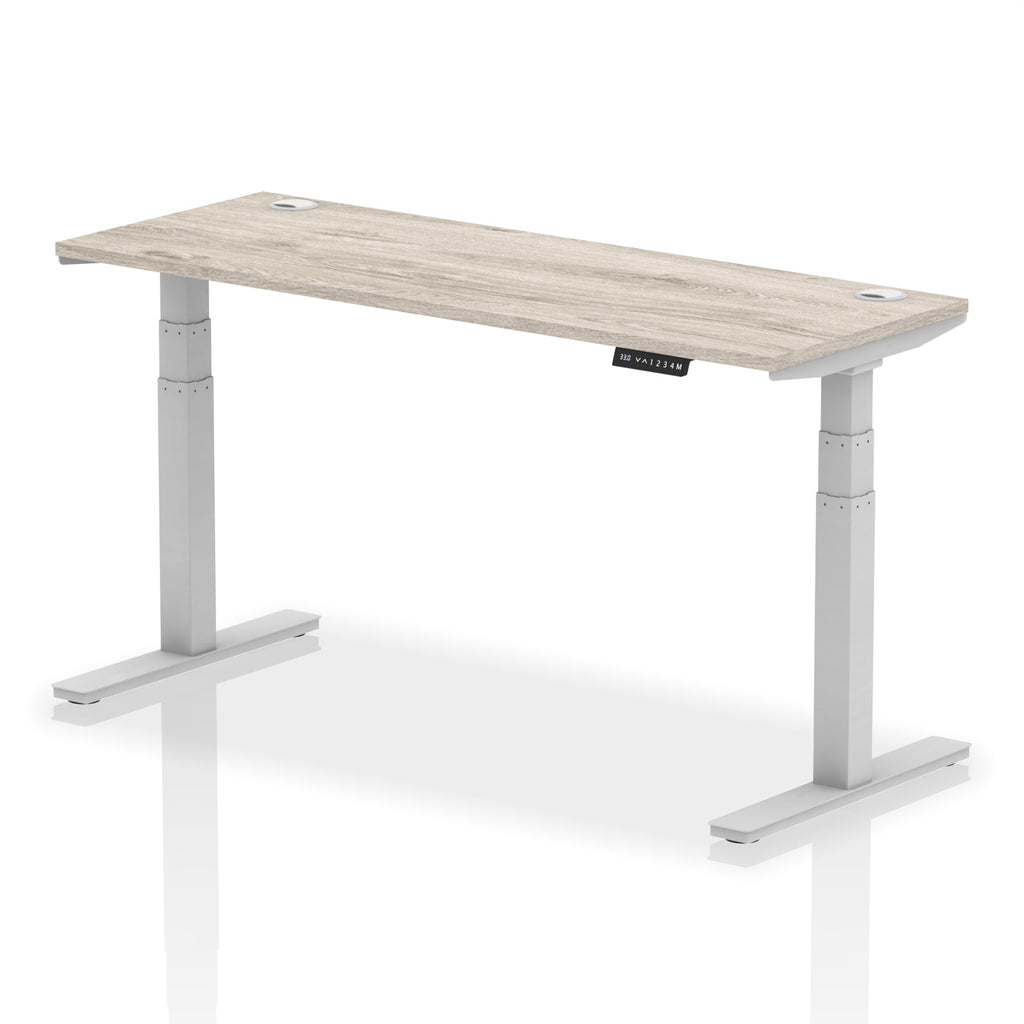 Adjustable height desk with wood-effect top and metal legs on a white background