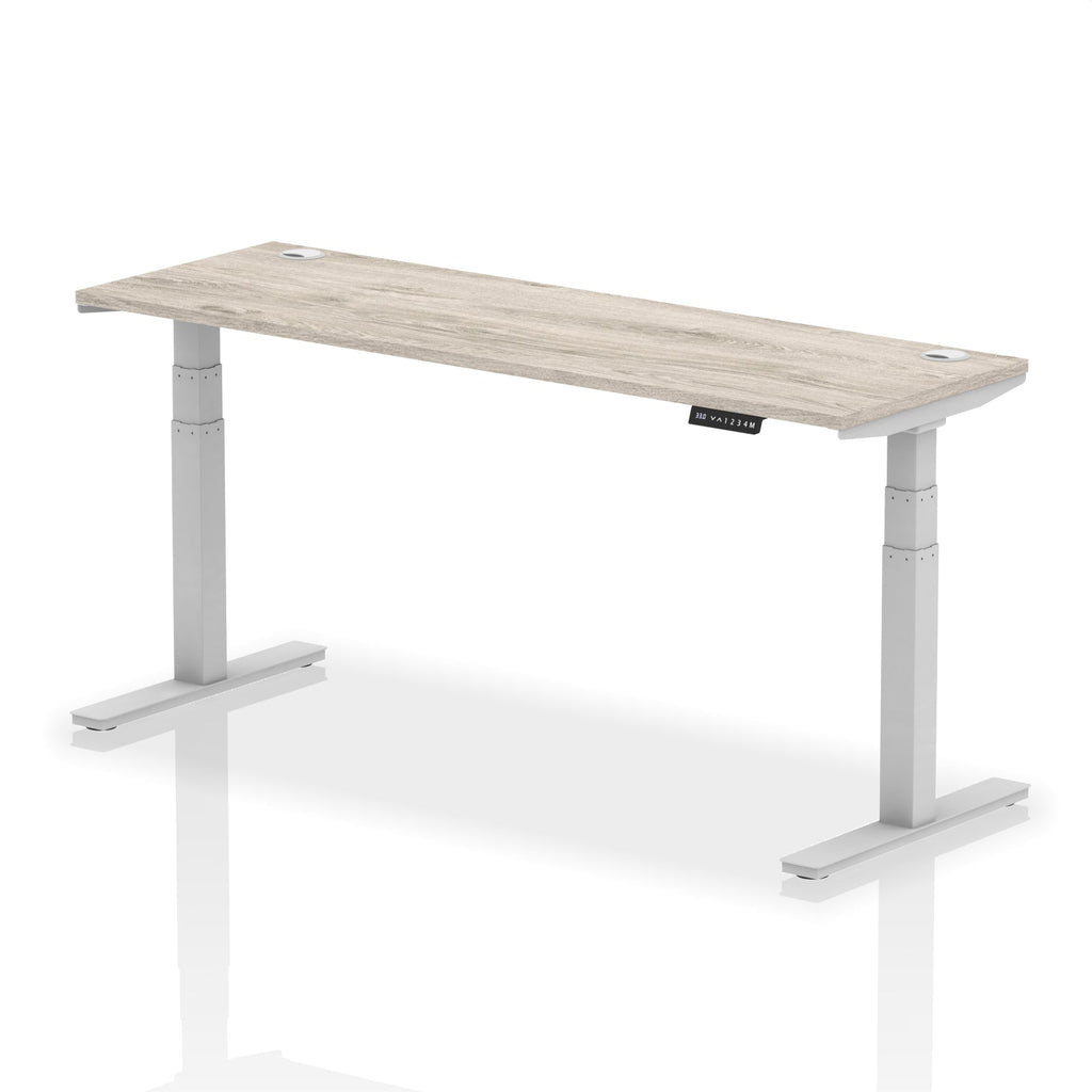 Adjustable height desk with wood-effect top and metal legs on a white background
