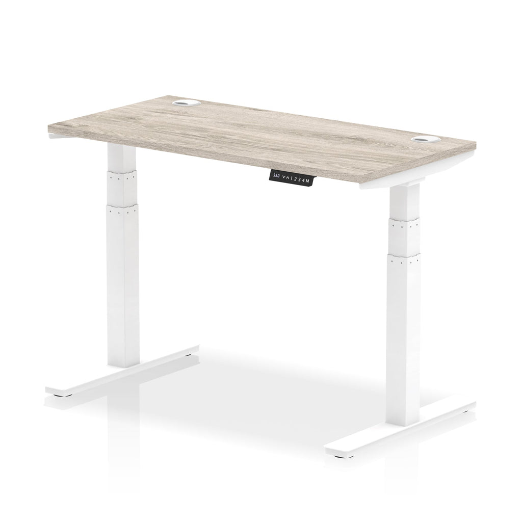Adjustable height desk with wood-effect top and metal legs on a white background