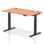 Adjustable height desk with wood-effect top and metal legs on a white background