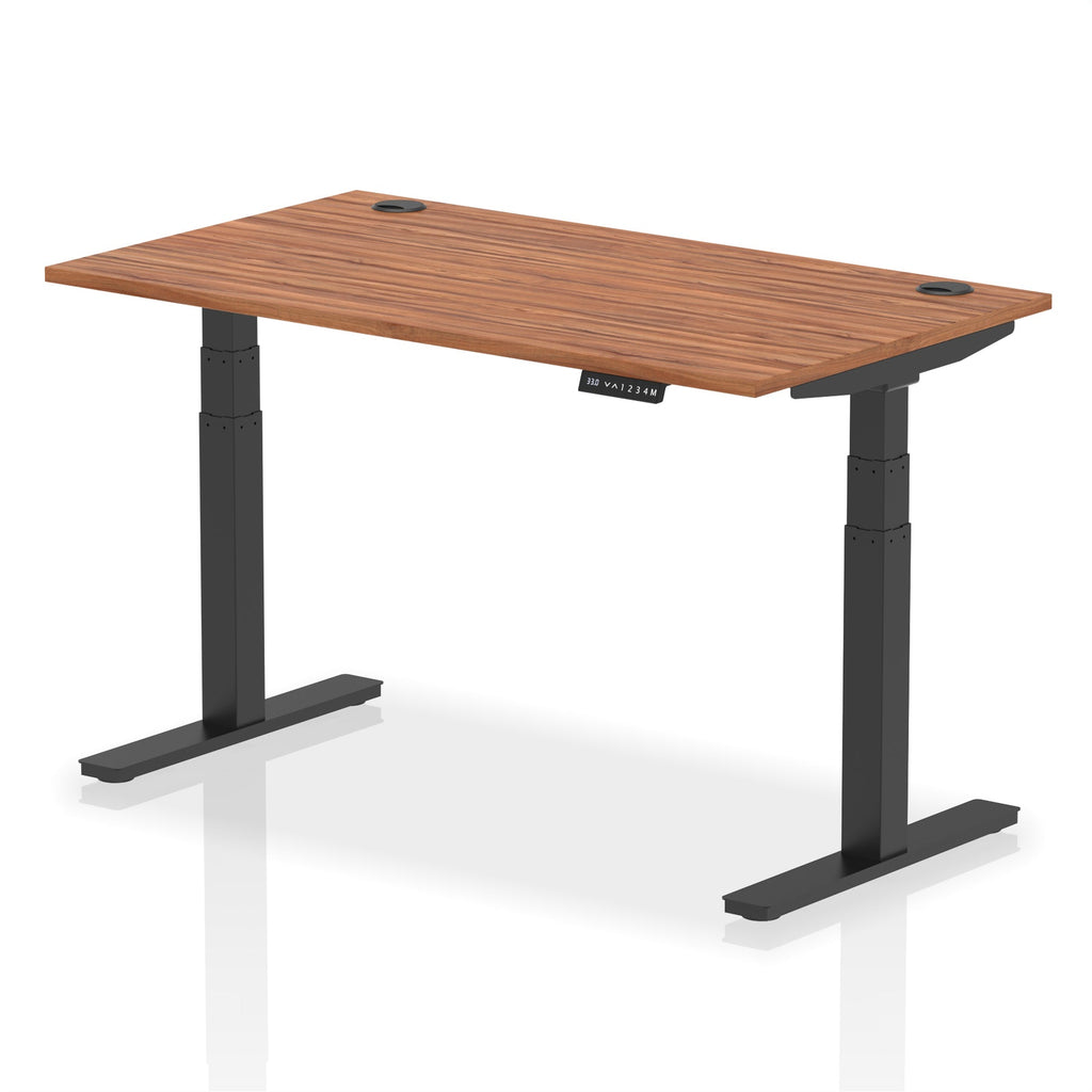 Adjustable height desk with wood-effect top and metal legs on a white background