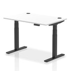 Adjustable height desk with white top and metal legs on a white background