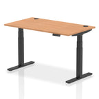 Adjustable height desk with wood-effect top and metal legs on a white background
