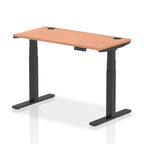 Adjustable height desk with wood-effect top and metal legs on a white background