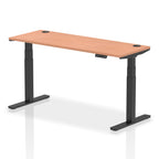 Adjustable height desk with wood-effect top and metal legs on a white background