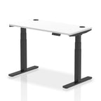 Adjustable height desk with white top and metal legs on a white background
