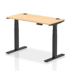 Adjustable height desk with wood-effect top and metal legs on a white background