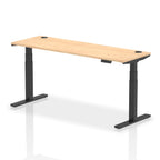 Adjustable height desk with wood-effect top and metal legs on a white background