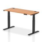 Adjustable height desk with wood-effect top and metal legs on a white background