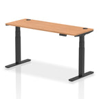 Adjustable height desk with wood-effect top and metal legs on a white background