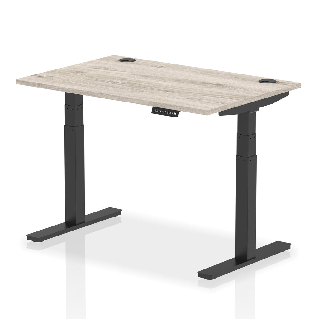 Adjustable height desk with wood-effect top and metal legs on a white background