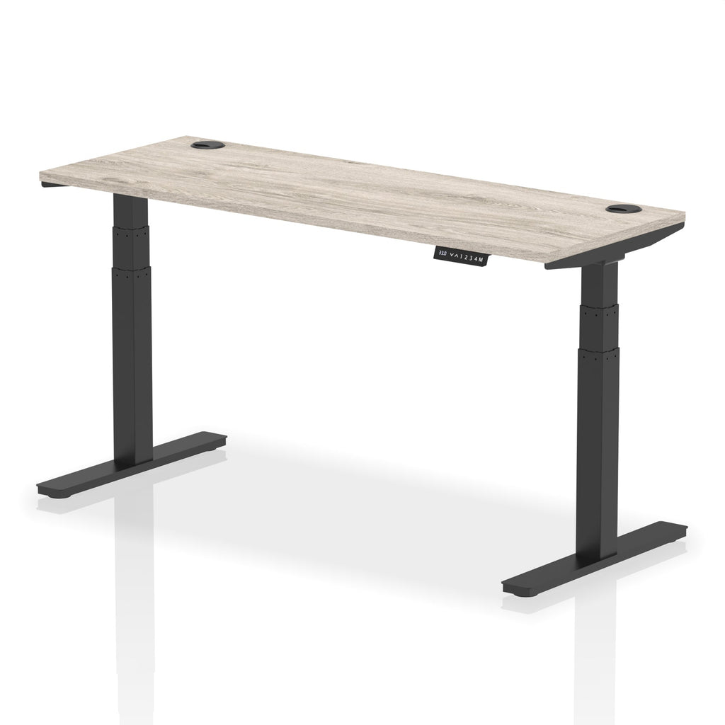 Adjustable height desk with wood-effect top and metal legs on a white background