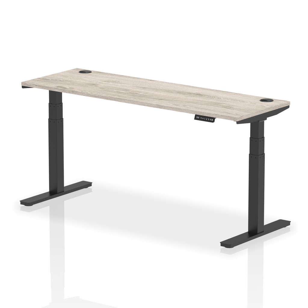 Adjustable height desk with wood-effect top and metal legs on a white background