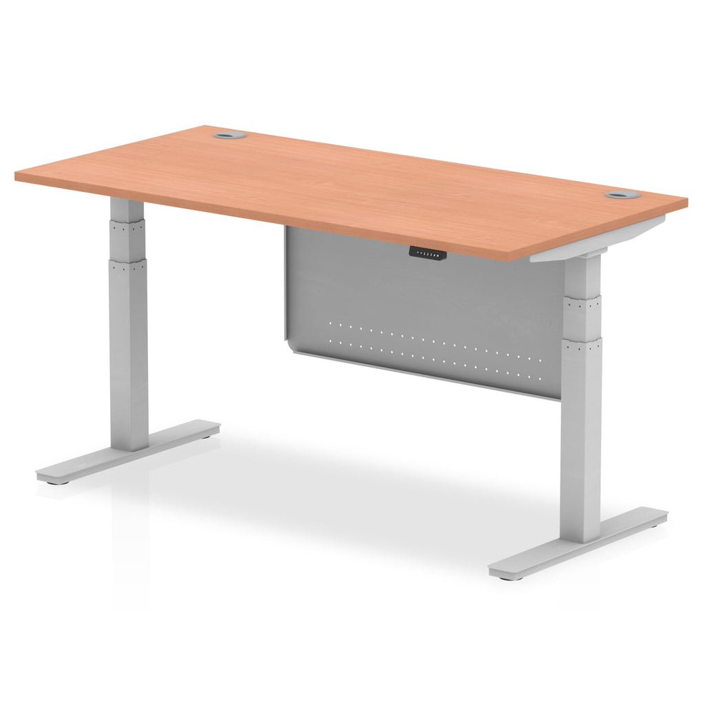 Adjustable height desk with wood-effect top and metal legs with modesty panel on a white background