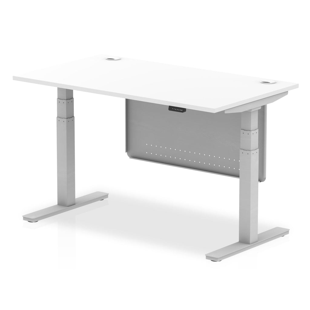 Adjustable height desk with white top and metal legs with modesty panel on a white background