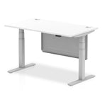 Adjustable height desk with white top and metal legs with modesty panel on a white background