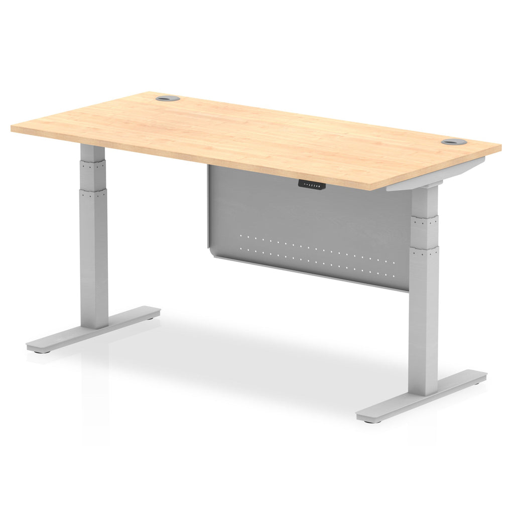 Adjustable height desk with wood-effect top and metal legs with modesty panel on a white background