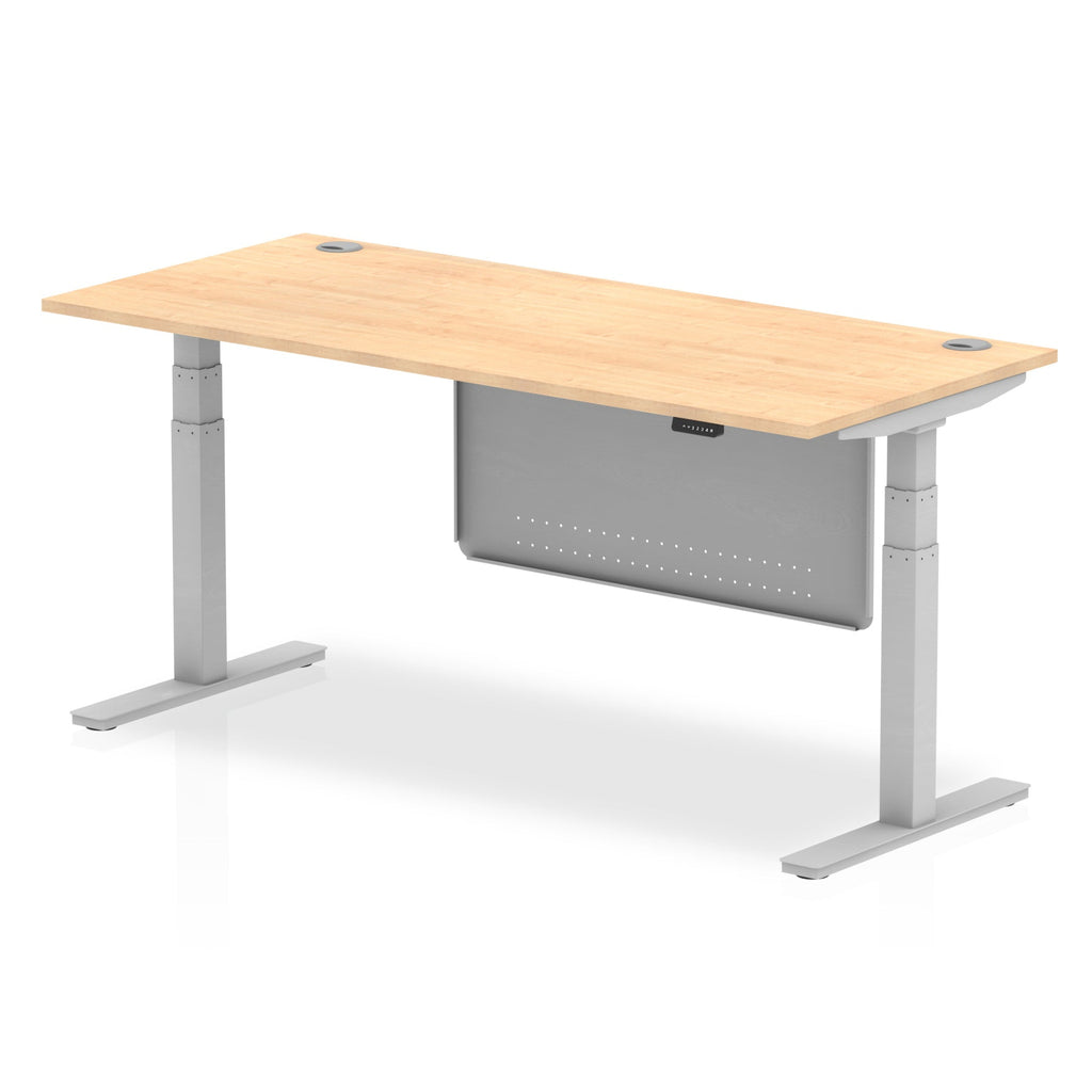 Adjustable height desk with wood-effect top and metal legs with modesty panel on a white background