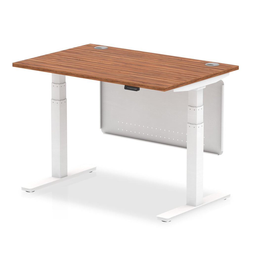 Adjustable height desk with wood-effect top and metal legs with modesty panel on a white background
