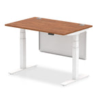 Adjustable height desk with wood-effect top and metal legs with modesty panel on a white background