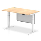 Adjustable height desk with wood-effect top and metal legs with modesty panel on a white background