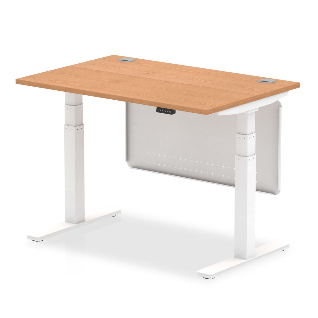 Adjustable height desk with wood-effect top and metal legs with modesty panel on a white background