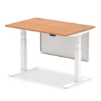 Adjustable height desk with wood-effect top and metal legs with modesty panel on a white background