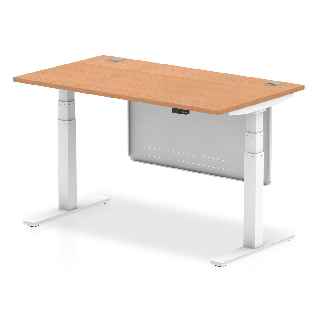 Adjustable height desk with wood-effect top and metal legs with modesty panel on a white background