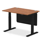 Adjustable height desk with wood-effect top and metal legs with modesty panel on a white background