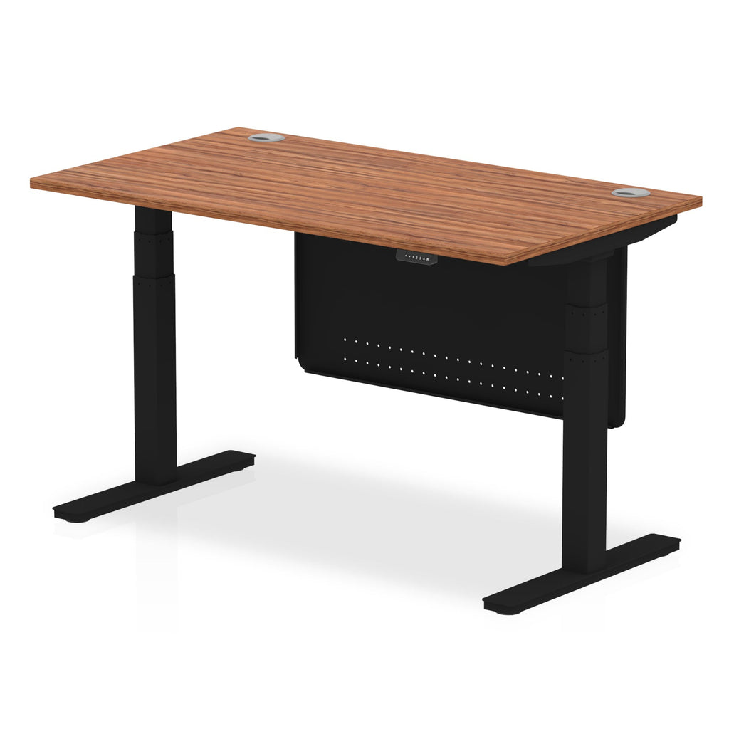 Adjustable height desk with wood-effect top and metal legs with modesty panel on a white background