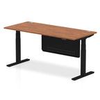 Adjustable height desk with wood-effect top and metal legs with modesty panel on a white background