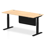 Adjustable height desk with wood-effect top and metal legs with modesty panel on a white background