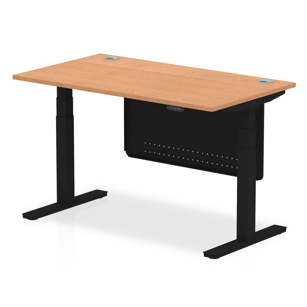 Adjustable height desk with wood-effect top and metal legs with modesty panel on a white background