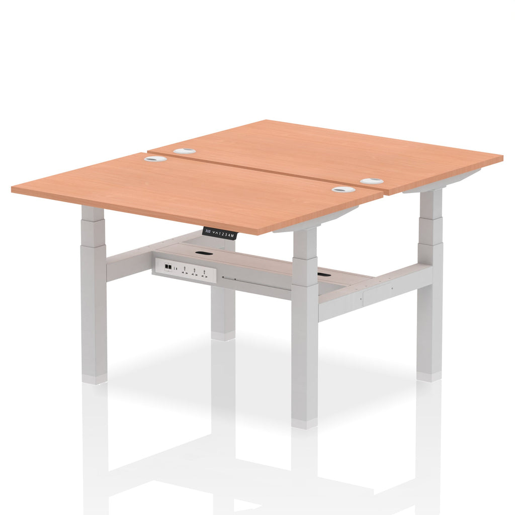 Back-to-back height adjustable desk with wood-effect top and metal frame on a white background