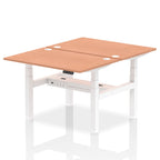 Back-to-back height adjustable desk with wood-effect top and metal frame on a white background